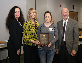 Student receiving award from Dr. Toni Hopper Pendergrass, President of San Juan College, Gayle Dean, Executive Director of the San Juan College Foundation, and T Greg Merrion with the Merrion Family Foundation